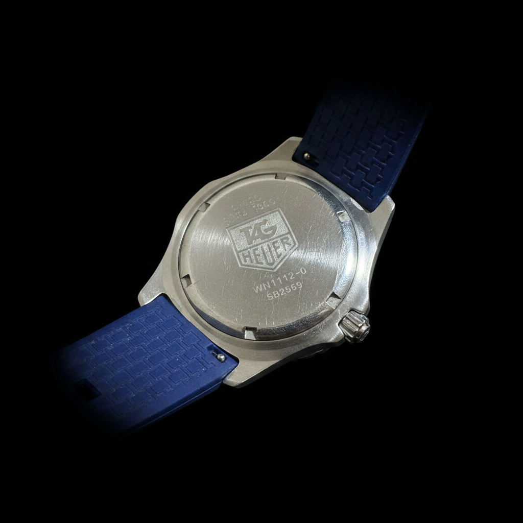 TAG Heuer Professional 200M - Caseback with TAG Heuer logo on black background